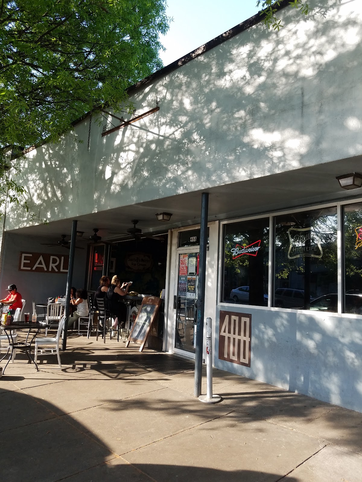 Dim live music bar room with a low stage at The Earl in East Atlanta Village