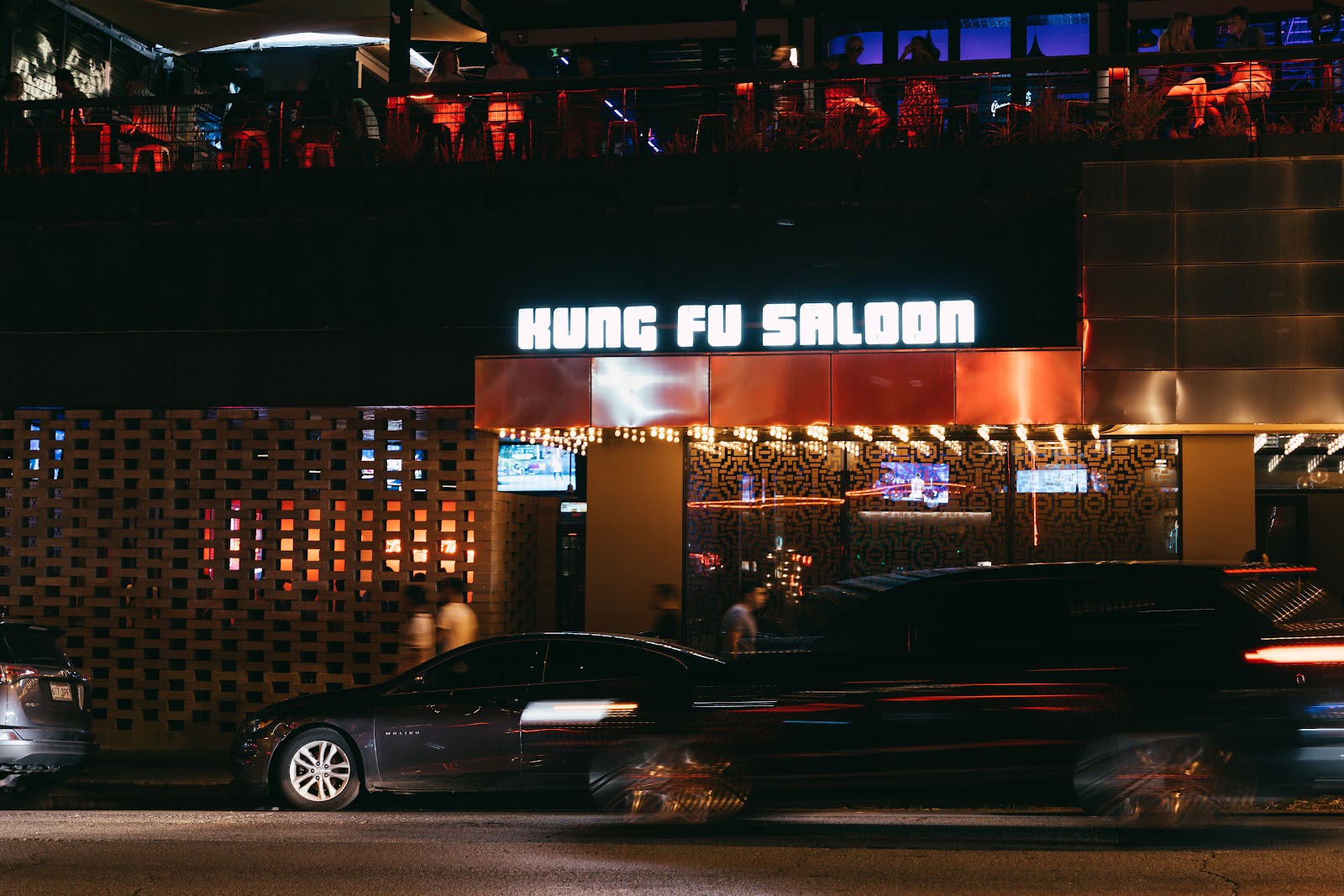 Kung Fu Saloon interior with arcade games and sports screens, West 6th Austin