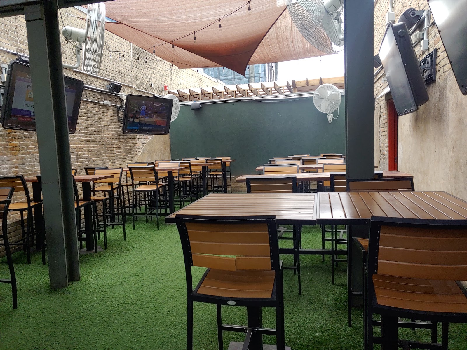 Lavaca Street Bar interior with screens, downtown Austin Warehouse District