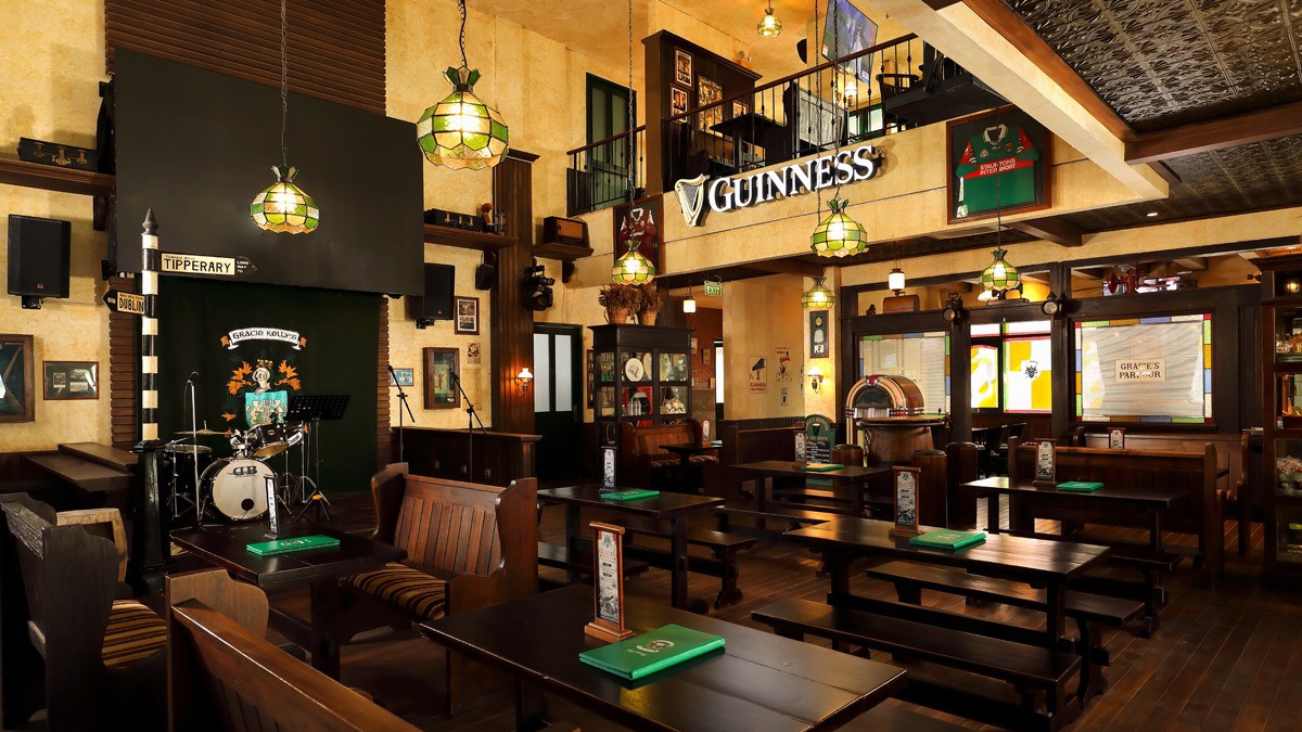 Gracie Kelly's Irish Pub interior with screens and stage, Kuta Bali