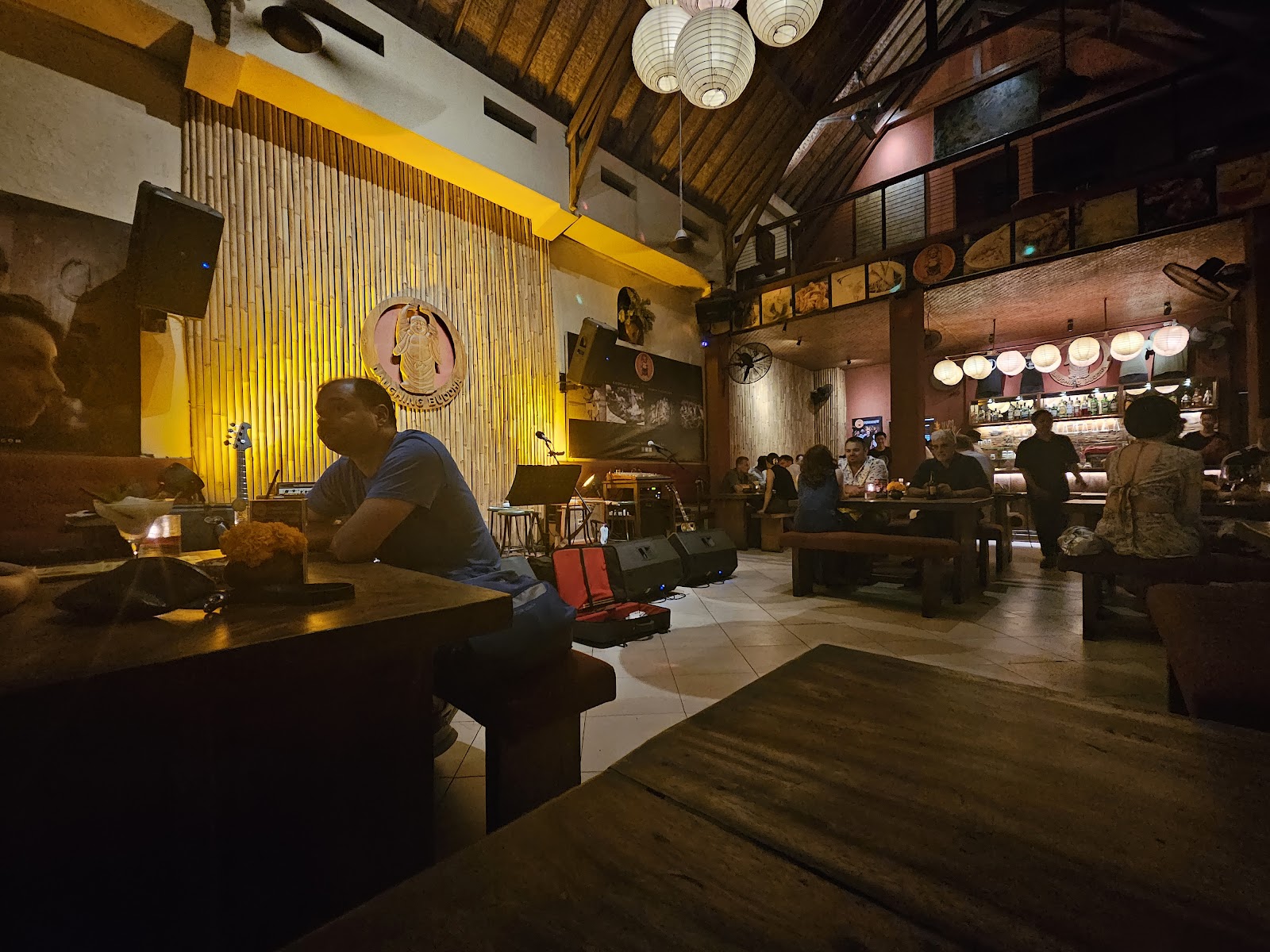 Live band playing in a warm, low lit bar in Ubud, Bali