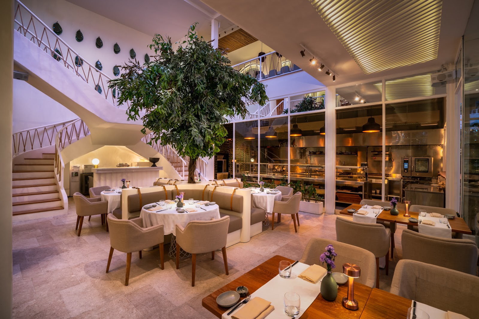 Dark, intimate fine dining room and bar interior in Seminyak, Bali