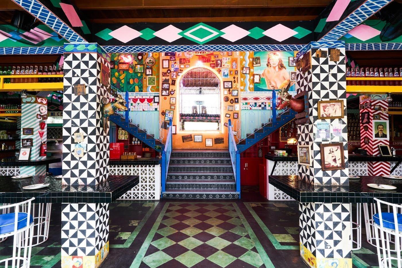 Motel Mexicola bar interior, Seminyak Bali, lush tropical garden with colourful lighting and cocktail bar