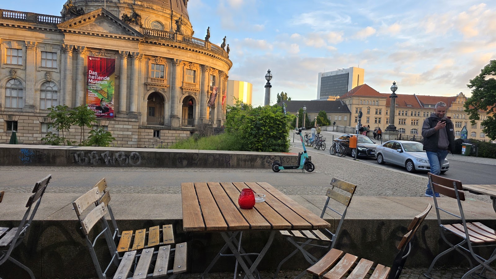 Open-air riverside bar with string lights like Strandbar Mitte on the Spree in Berlin