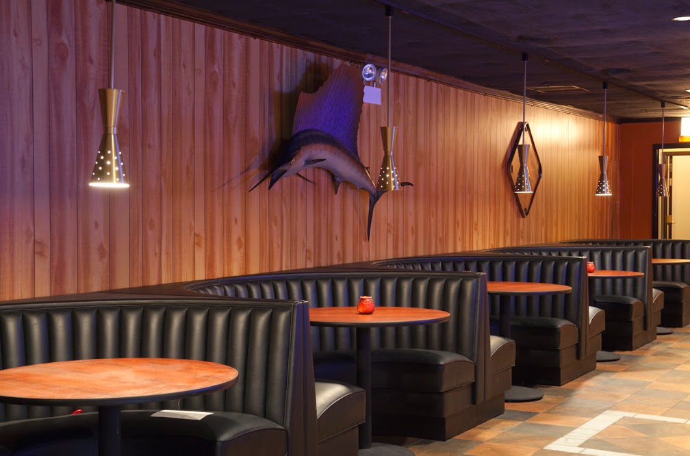 Low-lit wood panelled basement cocktail bar, Punch House Pilsen Chicago