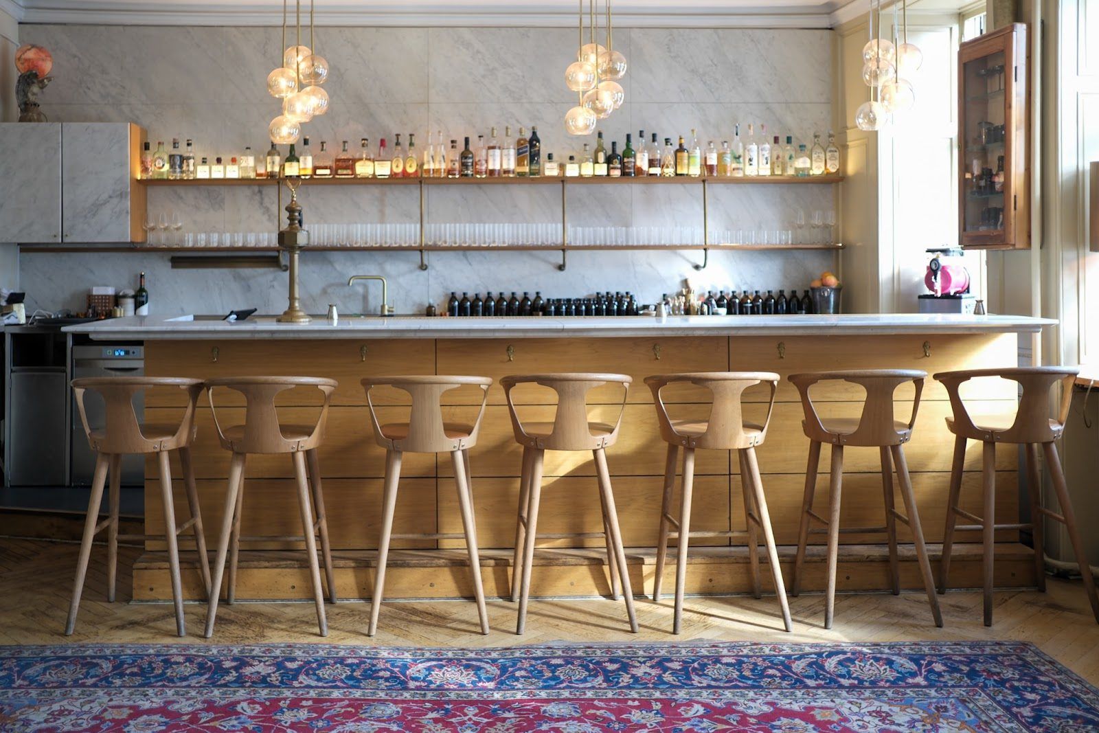 Ruby cocktail bar Copenhagen dark interior historic mansion