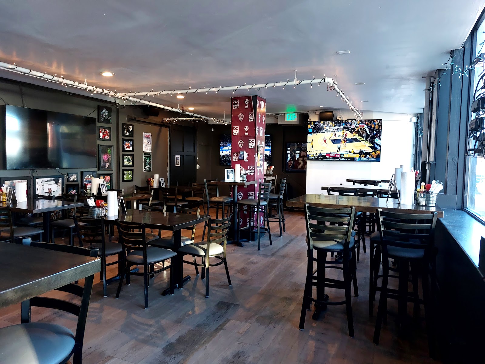 DNVR Bar sports bar interior with screens on East Colfax Denver
