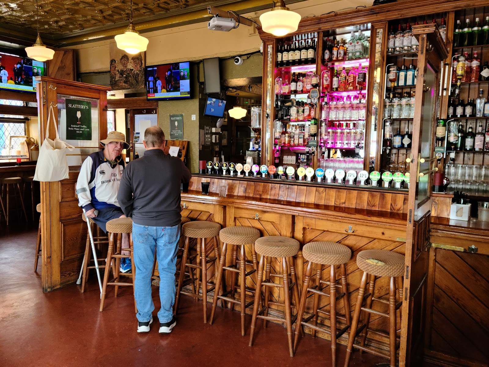 Traditional Dublin pub interior with dark wood and snugs at Slattery's Rathmines