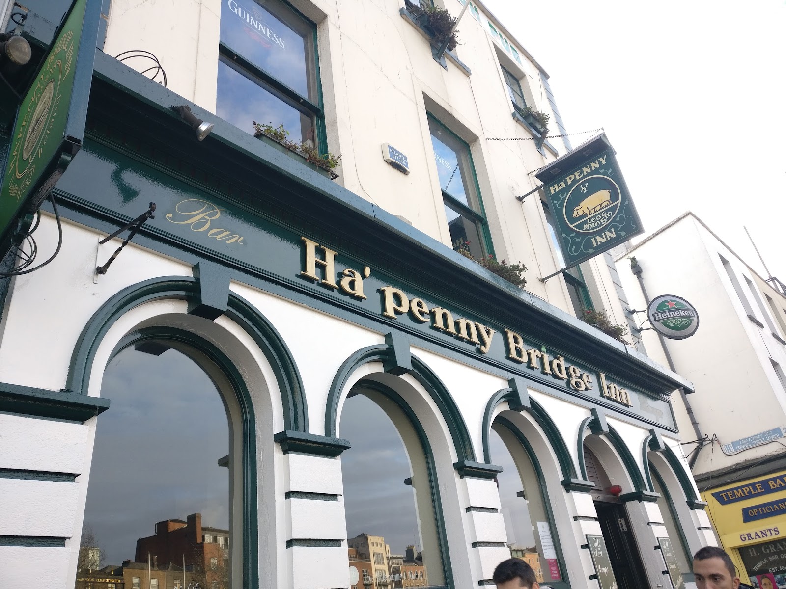 Traditional Irish pub interior with warm light and a worn bar