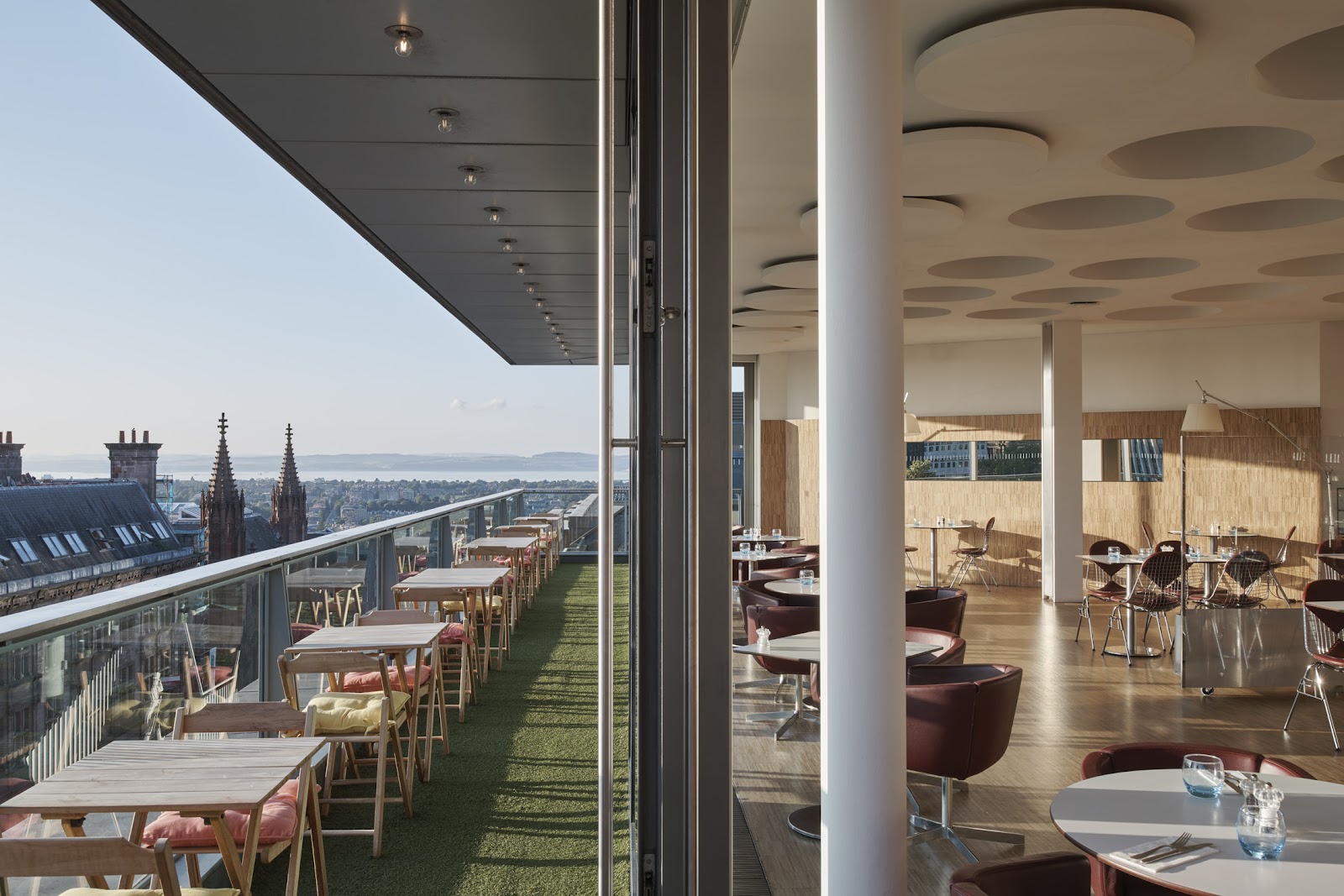 Top-floor bar with floor-to-ceiling windows and wrap-around terrace at Harvey Nichols Edinburgh