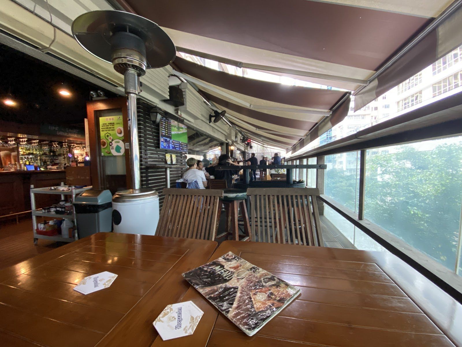 Sports bar interior with large screens and jerseys, Lockhart Road, Wan Chai