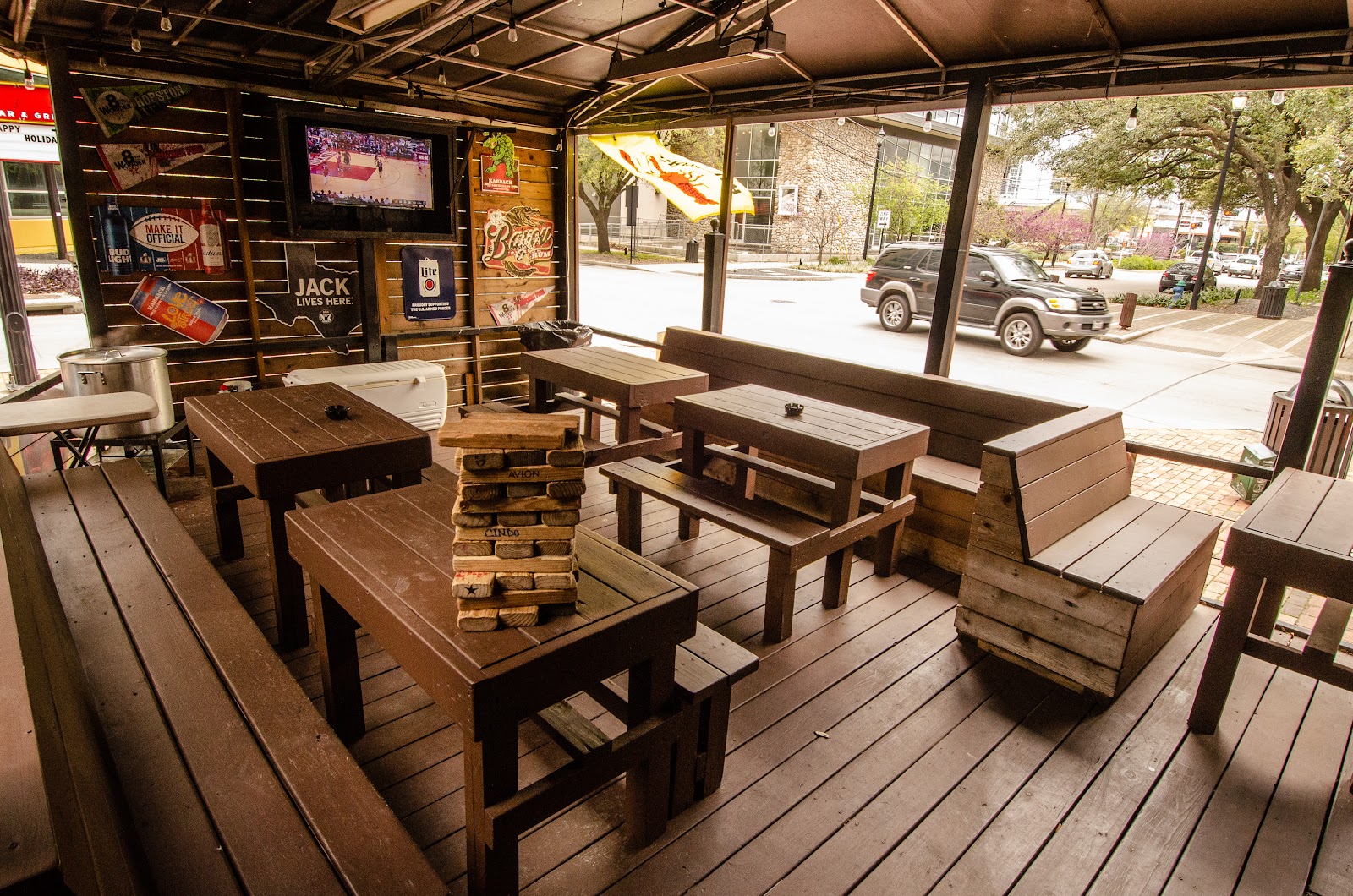 Burger and a beer on a worn sports bar counter in Houston