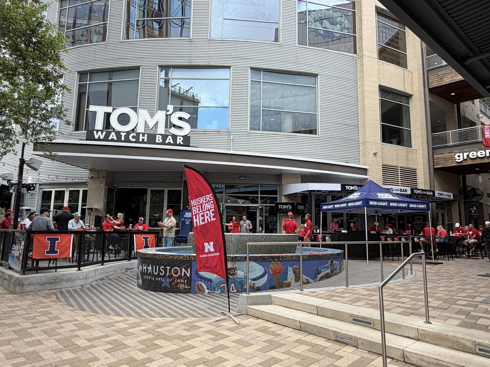 Sports bar with a large central screen ringed by smaller TVs in downtown Houston