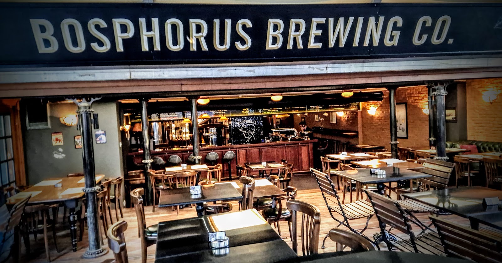 Rows of house-brewed beer on tap at a craft brewpub like Bosphorus Brewing Company in Gayrettepe, Istanbul