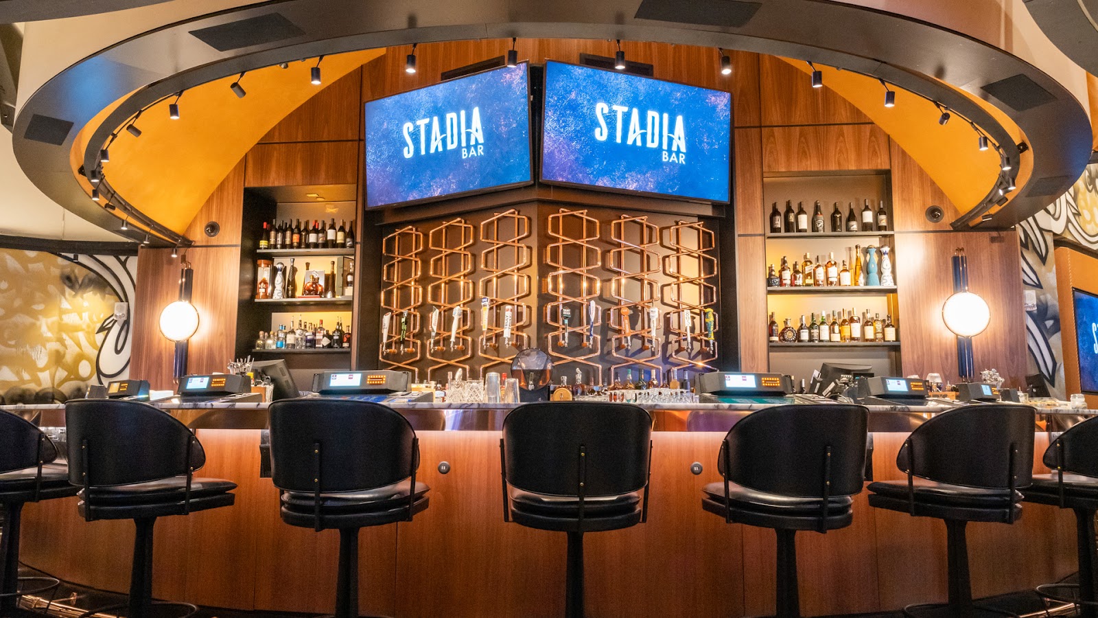 Stadia Bar interior with a wall of screens inside Caesars Palace, Las Vegas