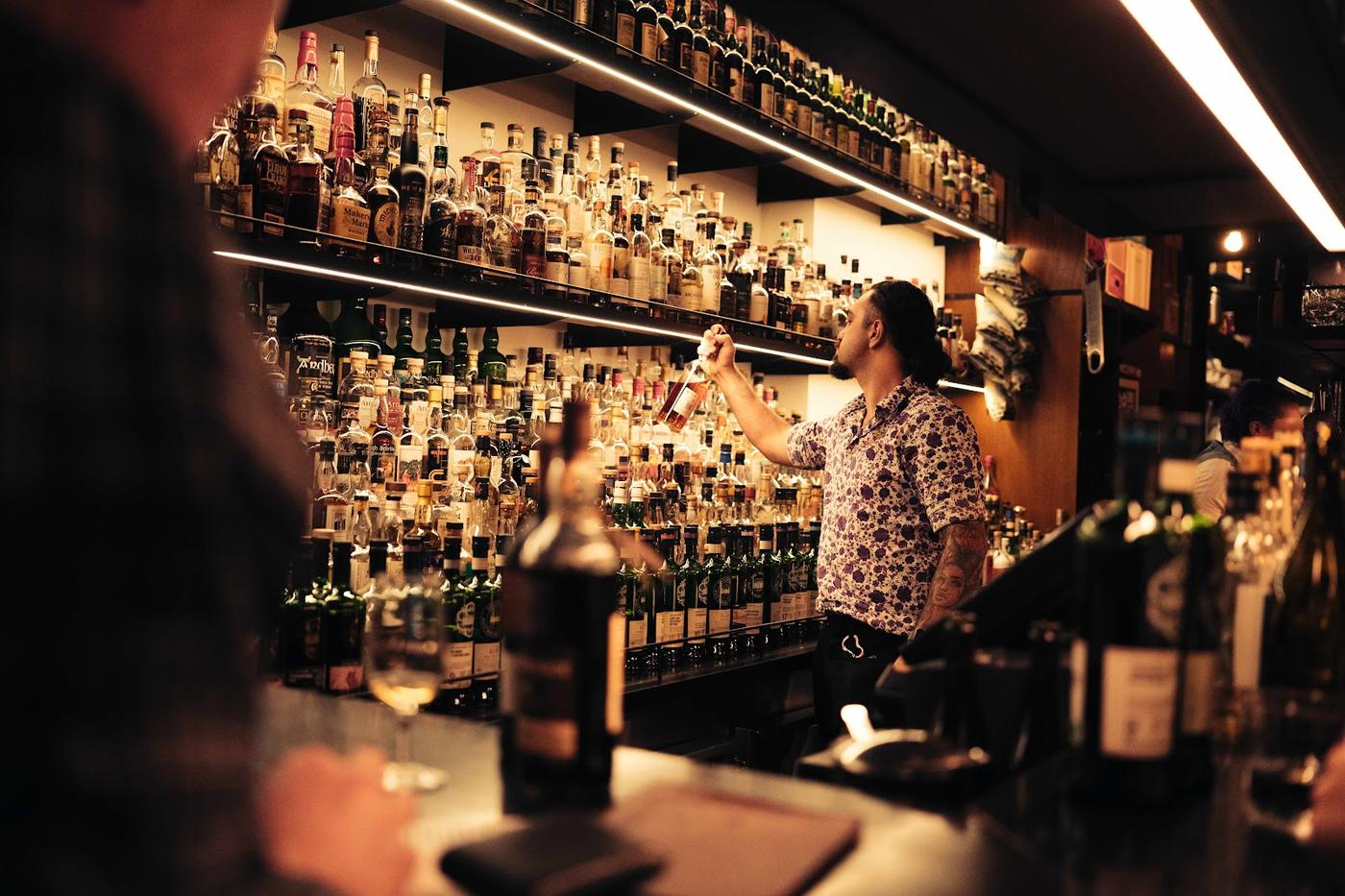 Whisky and Alement Melbourne bar wall of whisky bottles Russell Street