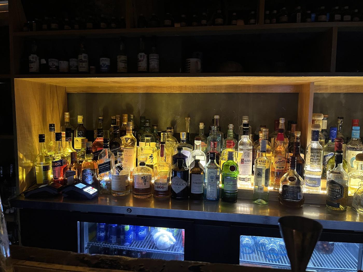 Xaman Bar mezcal back bar — bottle wall