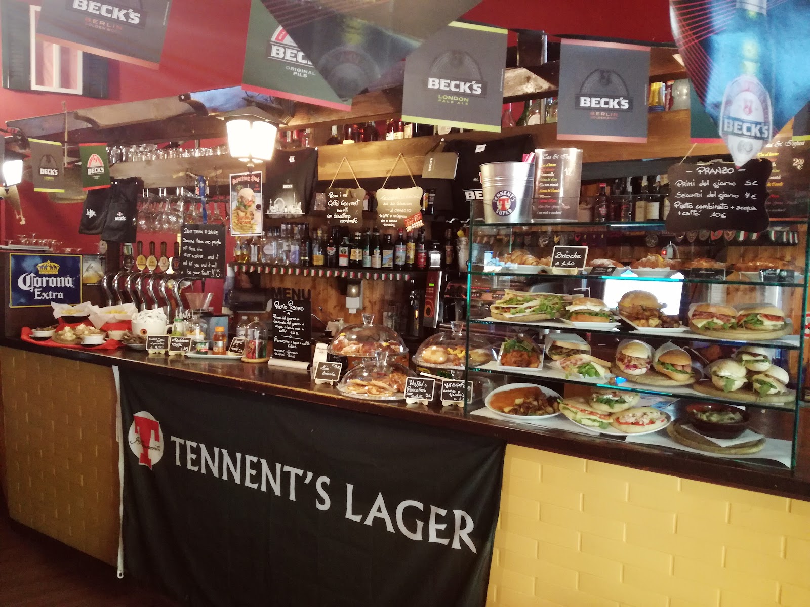Sports pub interior with taps and screens between Niguarda and Bicocca, Milan