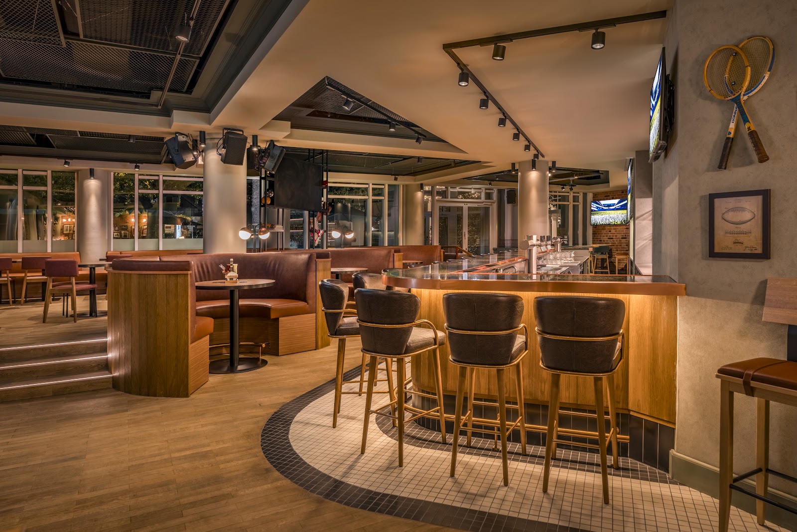 American sports bar with large screens and booth seating in Munich