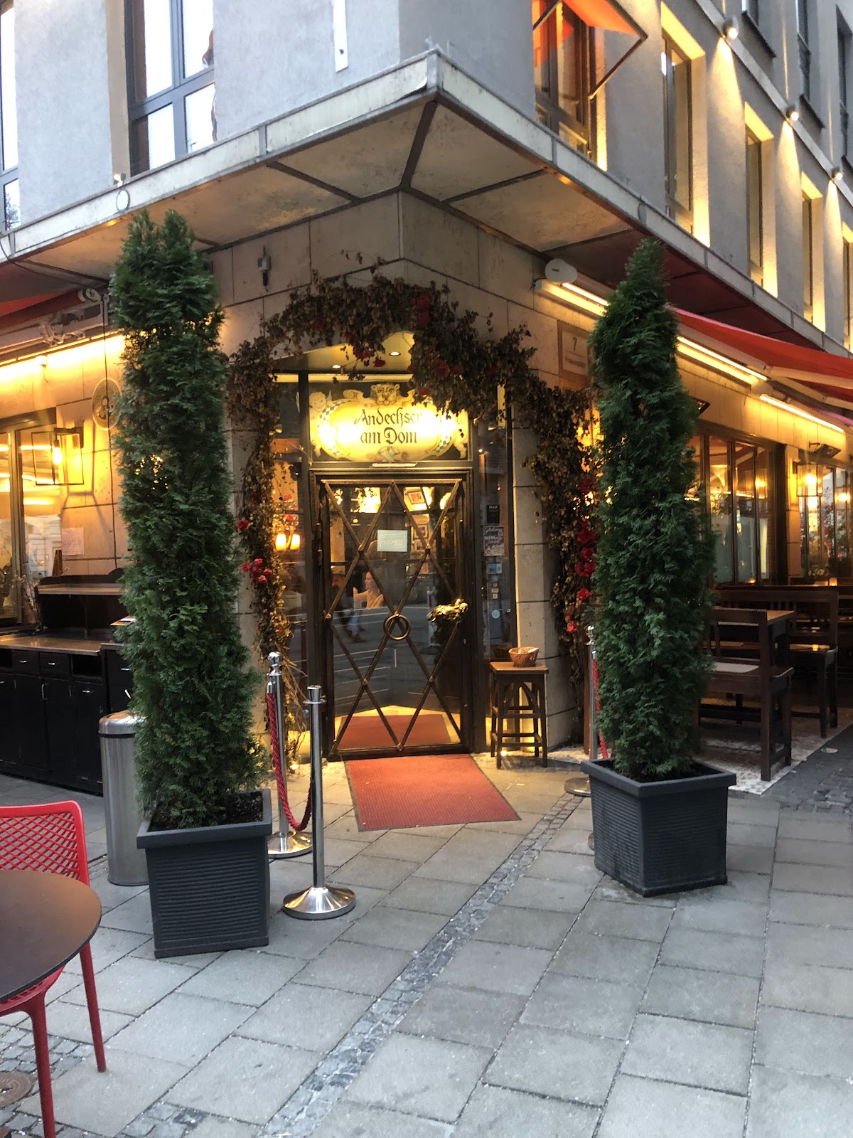 Wood-lined pub interior with sports screens near Munich's Frauenkirche