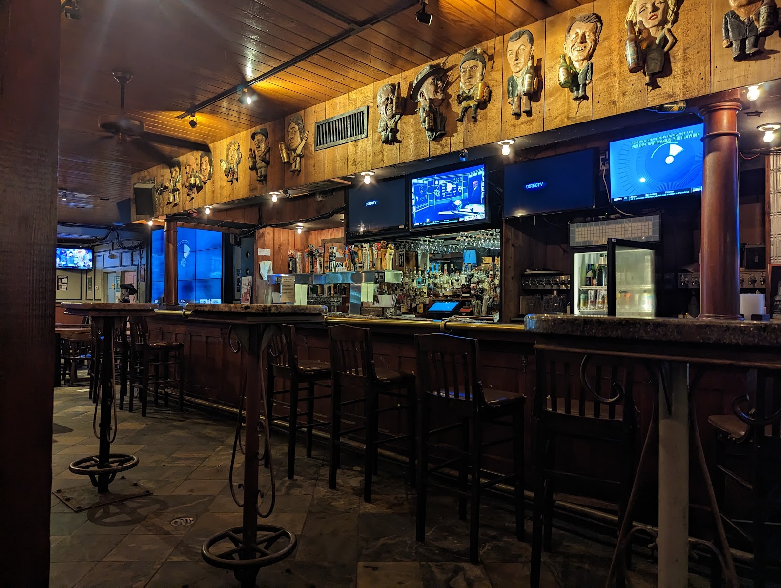 Sports bar with rows of beer taps, TVs and an oyster counter in New Orleans