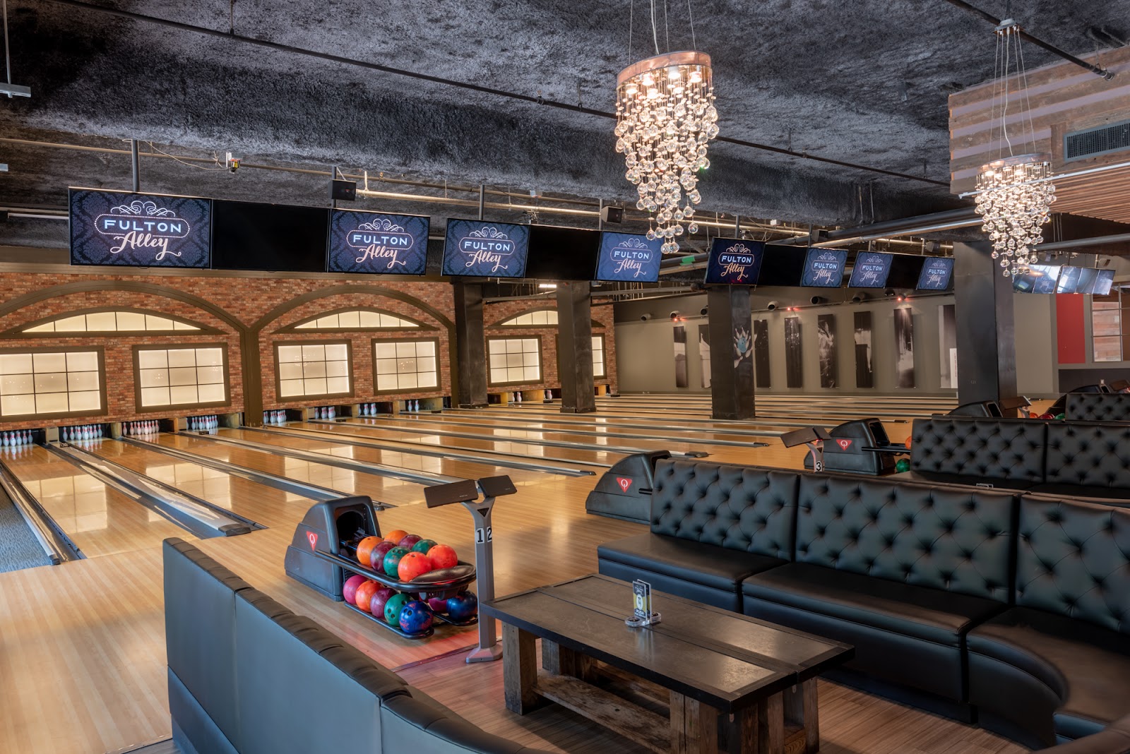 Cocktail bar with low lighting beside boutique bowling lanes in the New Orleans Warehouse District