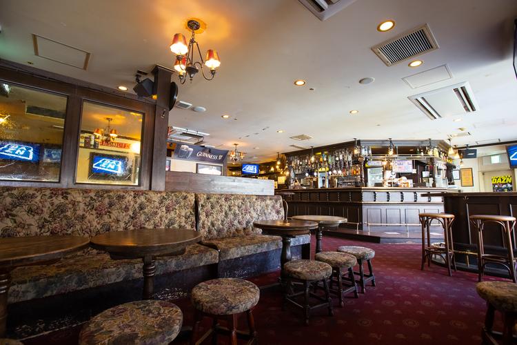 British-style pub interior with screens and a long bar, Shinsaibashi, Osaka