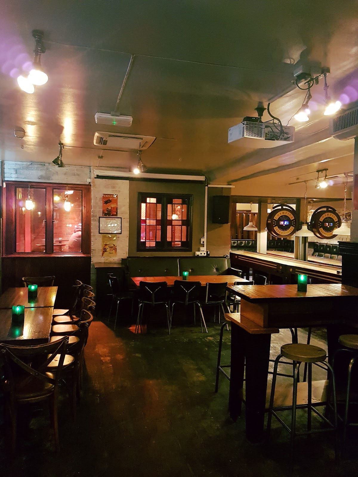 The Dubliner Folk Pub interior with screens and a bar in Oslo's Kvadraturen