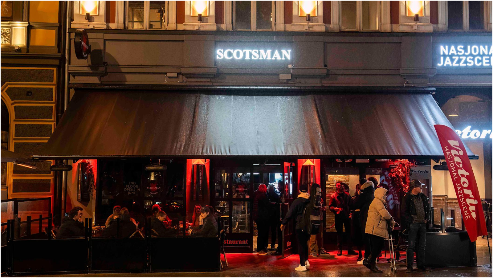 The Scotsman pub bar with whisky shelf and screens on Karl Johans gate, Oslo