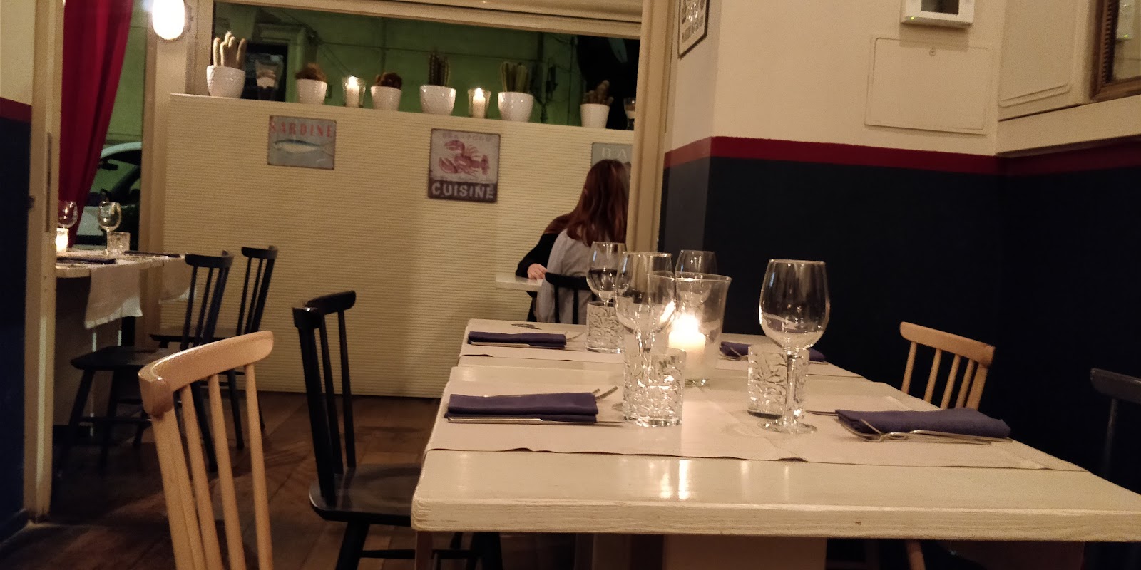 Molo 10 seafood osteria table with raw fish and wine near Ponte Milvio, Rome