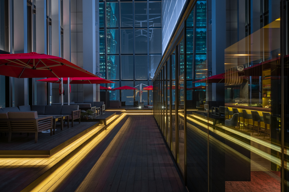 Taipei rooftop bar at dusk with skyline view, Xinyi District