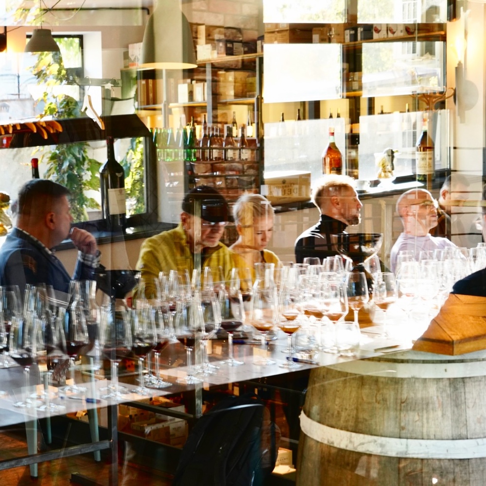 Mielzynski wine bar shelves and tasting tables in a former lace factory, Warsaw