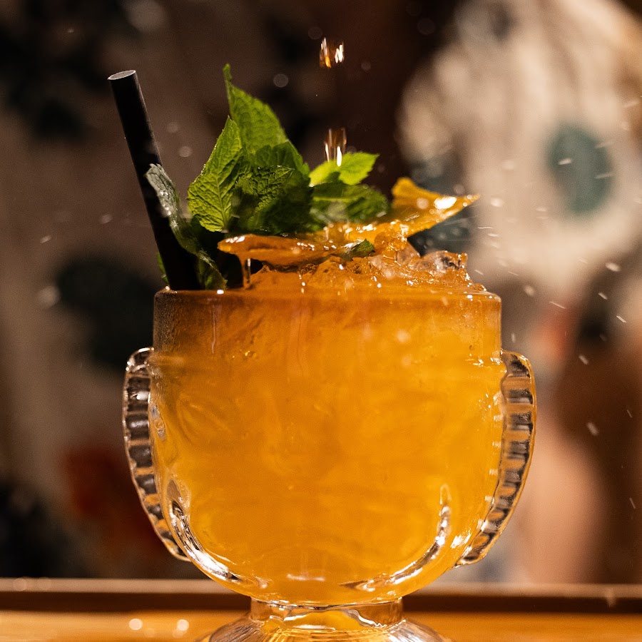 Carved tiki masks and bamboo at Waiana Tiki Bar, Zurich