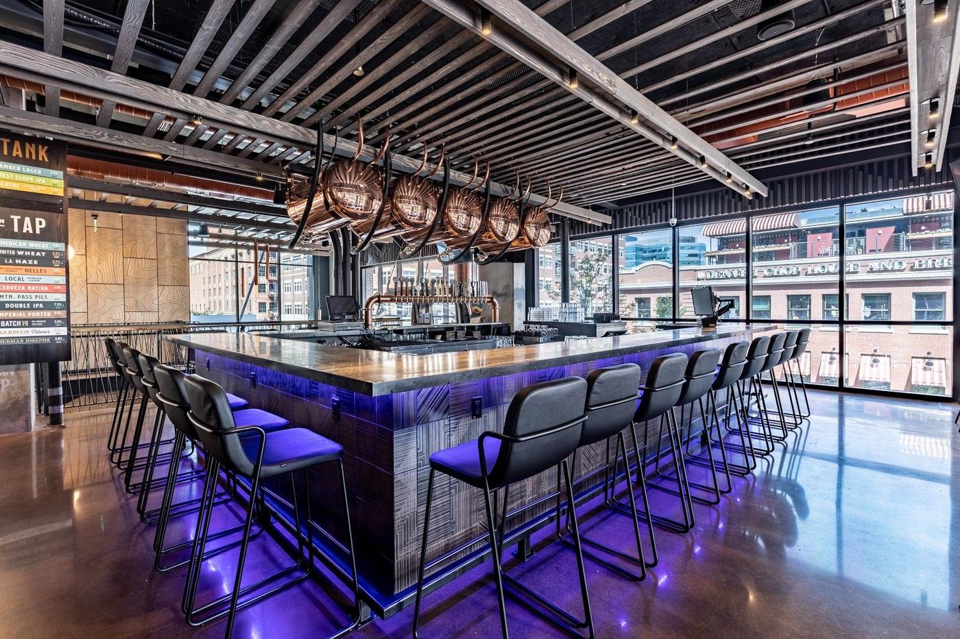 Outdoor bar patio with tables at dusk